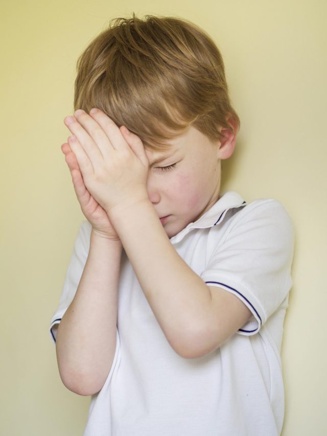 child keeping hans on right eye due to eye fatigue