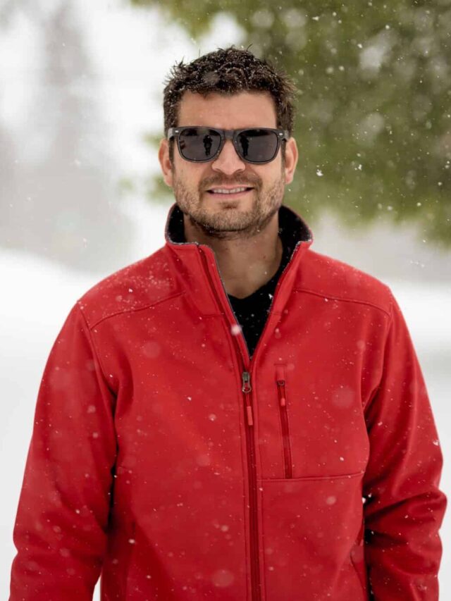 closeup-shot-male-wearing-red-jacket-smiling-while-looking-camera