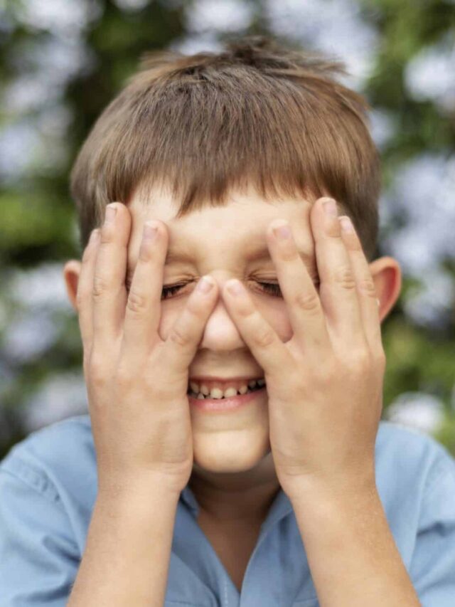 close-up-kid-covering-his-face
